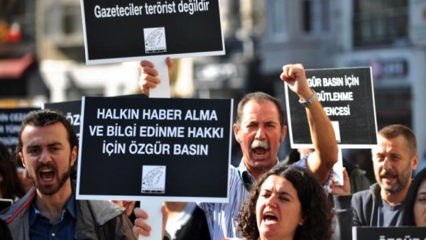 A file photo shows demonstrators protesting against freedom of speech infringements and journalists' arrests in Turkey last November. Sunday's raid attempt was only the most recent in a list of trouble journalists have faced with the Turkish government. (AFP/File)