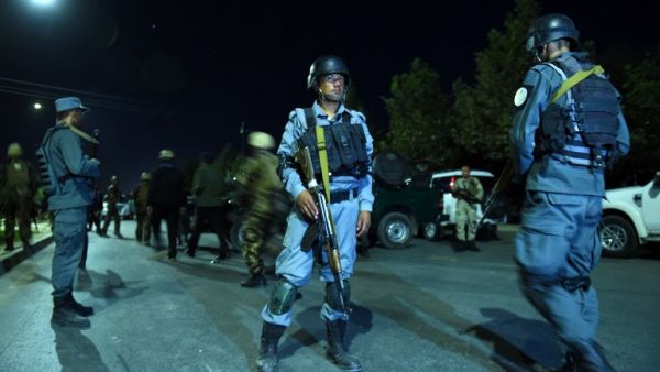 Afghan security personnel stand guard near the site of explosion that targeted the elite American University of Afghanistan in Kabul on August 24, 2016. (AFP/Wakhil Kohsar)