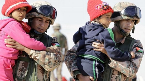 In a new poll, 65 percent of Jordanian respondents believe that the government should encourage Syrian refugees to go back to their country. (AFP/ Khalil Mazraawi)