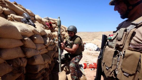 Kurdish peshmerga fighters outside of Sinjar, Iraq in August, 2015. (AFP/Safin Hamed)