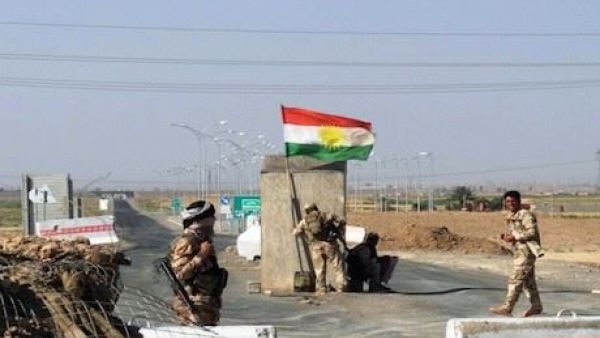 Kurdish forces guard a checkpoint between Kirkuk and Tikrit. Image used for illustrative purposes. (AFP/File)