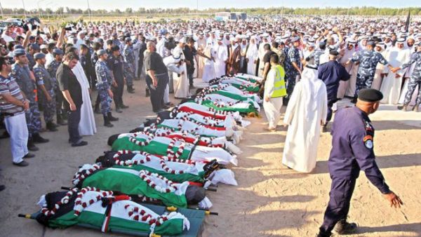 Mourners pray over the bodies of the victims of the al-Imam al-Sadeq mosque bombing in Kuwait City on June 27, 2015. (AFP/File) Mourners pray over the bodies of the victims of the al-Imam al-Sadeq mosque bombing in Kuwait City on June 27, 2015. (AFP/File)