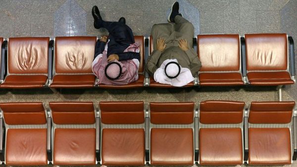 Kuwaiti traders sitting in the main hall at the Kuwait Stock Exchange (Boursa) headquarters in Kuwait City. (AFP)