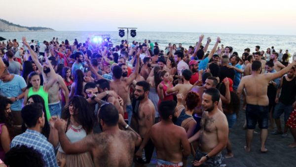 Young Syrians party at Wadi Qandeel beach in the Latakia region (AFP/File)