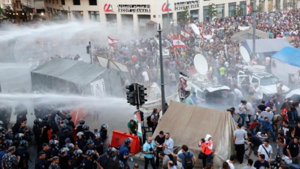 After a trash crisis in July, protesters and a hashtag in Beirut say the streets aren't the only thing that need cleaning. (AFP/File) 