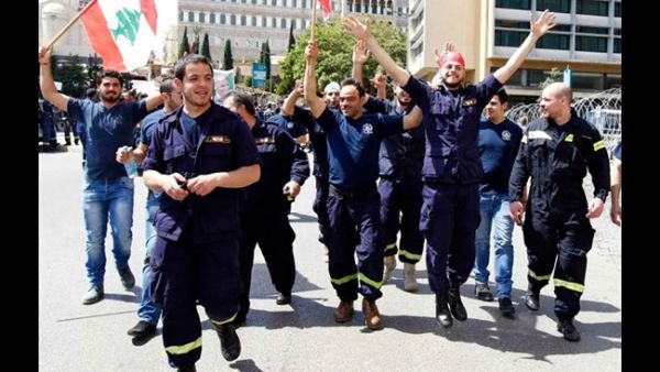 Civil Defense volunteers celebrating the decrees to make them full-time employees. (Image courtesy of The Daily Star)
