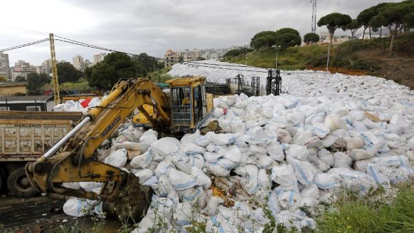 Lebanon's trash crisis, which abated earlier this year, seems ready to flare up again with different groups blocking the entrance to landfills. (AFP/File)