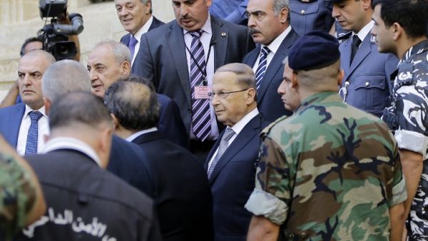 Newly elected Lebanese President Michel Aoun (C) leaves the parliament after a voting session on October 31, 2016 in downtown Beirut. (AFP/Joseph Eid)