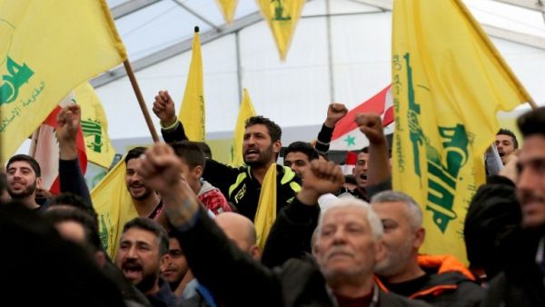 Supporters of Hezbollah rally around securing the electoral threshold in the Zoaiter in Jbeil seat (AFP/ File Photo)