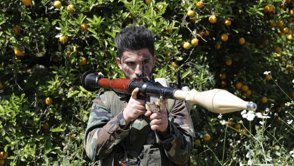 A Hezboallah fighter armed with an RPG stands near Lebanon's border with Israel, April 20 2017. (AFP/Joseph Eid)