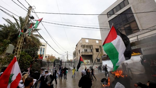 Protesters at  a demonstration outside the US embassy in Awkar on December 10, 2017 (Anwar Amro/AFP) Protesters at  a demonstration outside the US embassy in Awkar on December 10, 2017 (Anwar Amro/AFP)