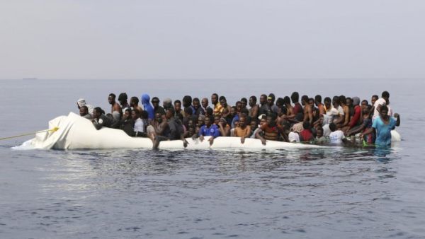  Migrants wait to be rescued from a sinking dinghy off the Libyan coast  (AFP/File Photo)	
