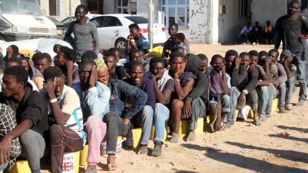 Migrants sit in a port in Tagiura, east of the Libyan capital Tripoli, after 137 people were rescued by coast guard boats off the coast of Libya on July 21, 2016. (AFP/Stringer) Migrants sit in a port in Tagiura, east of the Libyan capital Tripoli, after 137 people were rescued by coast guard boats off the coast of Libya on July 21, 2016. (AFP/Stringer)