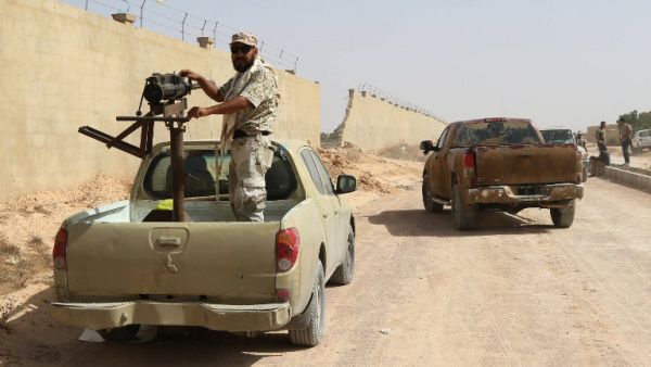 A fighter from forces loyal to Libya's Government of National Unity (GNA) stands on a truck mounted with a machine gun as he holds a position in Sirte during an operation to recapture the coastal city from Daesh, on July 2, 2016. (AFP/Mahmud Turkia) A fighter from forces loyal to Libya's Government of National Unity (GNA) stands on a truck mounted with a machine gun as he holds a position in Sirte during an operation to recapture the coastal city from Daesh, on July 2, 2016. (AFP/Mahmud Turkia)