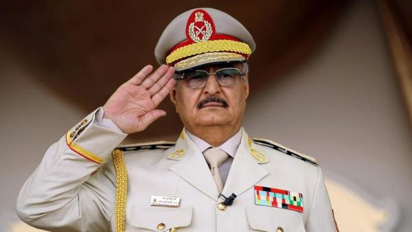 Khalifa Haftar salutes during a military parade in the eastern city of Benghazi. (AFP/ File)
