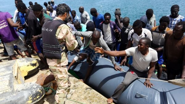 Migrants who were rescued by the Libyan coastguard in the Mediterranean Sea off the Libyan coast, arrive at the naval base in the capital Tripoli on May 6, 2017. (AFP/Mahmud Turkia)