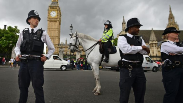 British police stand guard outside the Houses of Parliament in London. (AFP/File Photo)