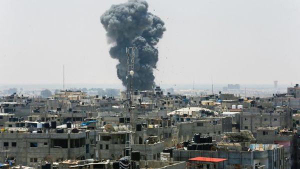 A heavy smoke cloud rises following an Israeli air strike in the southern Gaza Strip city of Rafah on July 14. (AFP)