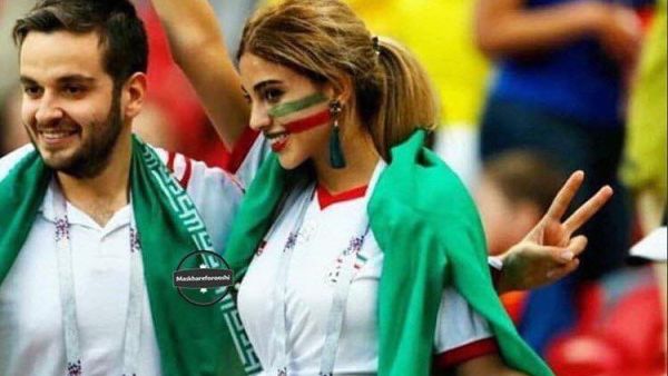 The image of an Iranian woman cheering her national football team without her hijab that appears in her ID has been going viral. (Social Media)