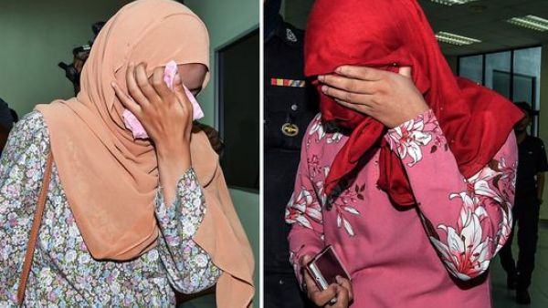 An image shows two women who were each caned six times on Sept. 3, 2018, in Malaysia.
(Photo from EPA-EFE)