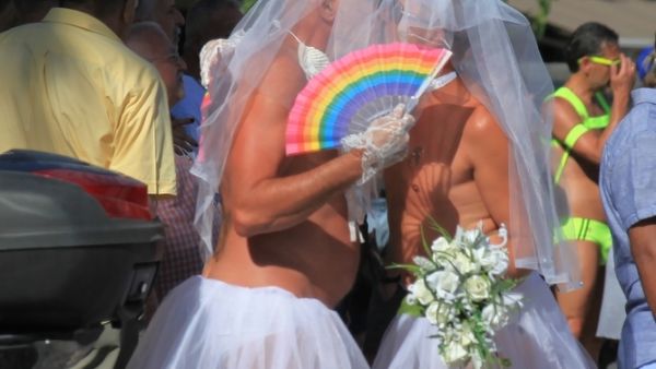 Novel image of two-men in bridal wear (Shutterstock/File Photo)