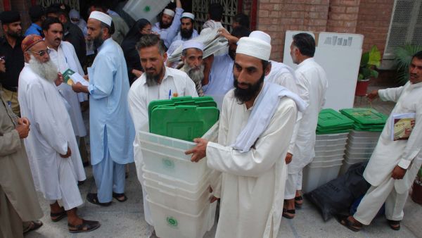 Presiding staffs carrying election material (Shutterstock/File Photo)