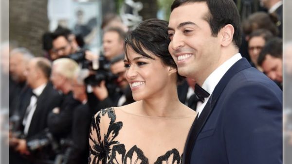 Michelle with her date Saudi Arabian film producer Mohammed al Turki. (AFP)