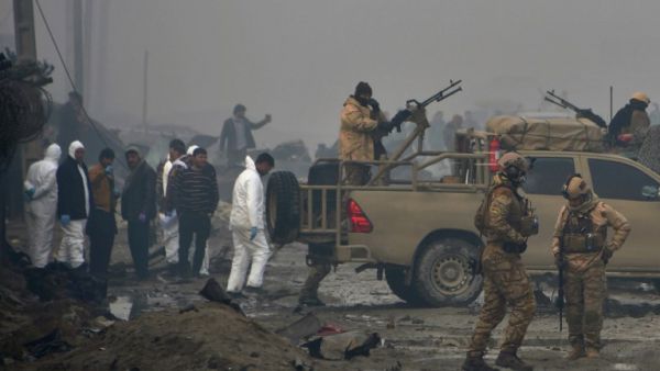 Afghan security forces and investigators gather at the site of a suicide bomb attack outside a British security firm's compound in Kabul, a day after the blast on November 29, 2018. (NOORULLAH SHIRZADA / AFP)