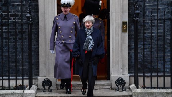 British Prime Minister Theresa May leaves Downing street to take part in a reception for Japan's Prime Minister Shinzo Abe in central London on January 10, 2019. (AFP)
