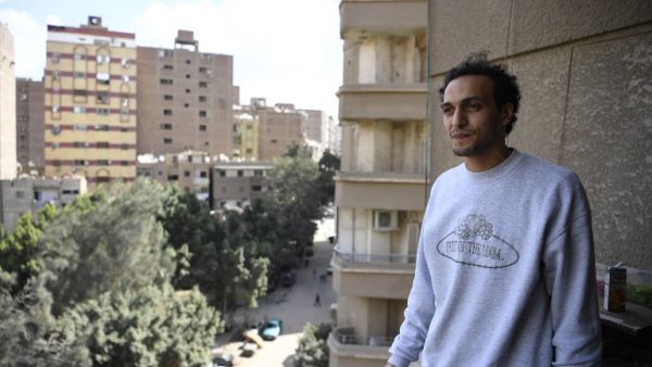 Egyptian photojournalist Mahmoud Abu Zeid, widely known as Shawkan, carries his camera at his home in the capital Cairo on March 4, 2019. (Khaled DESOUKI / AFP)