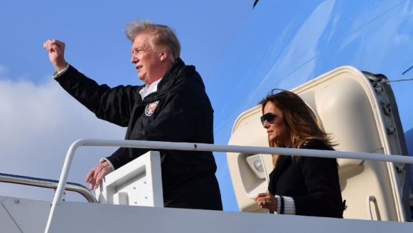 US President Donald Trump and first lady Melania Trump arrive at Palm Beach International Airport in Florida on March 8, 2019. (AFP)