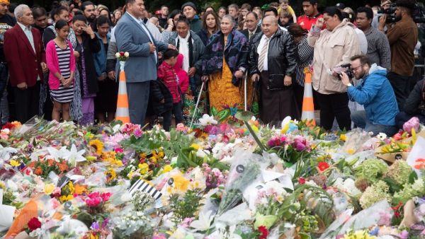 Samoan church members sing next to floral tributes in Christchurch on March 17, 2019 two days after a shooting incident at two mosques in the city. (AFP/ File photo)