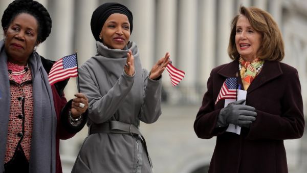 (L-R) Rep. Shelia Jackson Lee (D-TX), Rep. Ilhan Omar (D-MN) and Speaker of the House Nancy Pelosi (D-CA) rally with fellow Democrats during a rally on the East Steps of the U.S. Capitol. (AFP/ File)