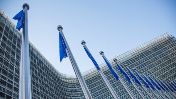 EU flags in front of the European Commission headquarters at the Berlaymont Building in Brussels. (AFP/File)