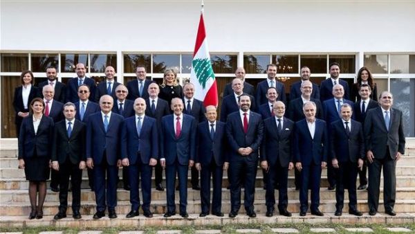 Lebanese President Michel Aoun (first row C), Prime Minister Saad Hariri (first row C-R), and Parliament Speaker Nabih Berri (first row C-L) posing with members of the newly-formed cabinet. (AFP)