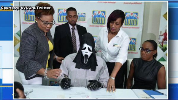Lottery winner claims prize in Scream mask to hide identity. (YouTube Screenshot)