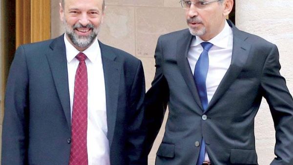 Jordan’s Foreign Minister Ayman Safadi (R) and Prime Minister Omar Razzaz at the Jordanian Royal Palace in Amman. (AFP)