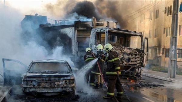 A firefighters putting out a burning truck and car during a wave of gang violence in Brazil’s northeastern city of Fortaleza, Ceara State, on January 3, 2019. (AFP)