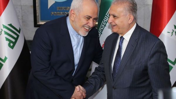 Iraqi Foreign Minister Mohammad Ali al-Hakim (R) receives his Iranian counterpart, Mohammad Javad Zarif, in Baghdad on January 13, 2019 (AFP Photo/SABAH ARAR)