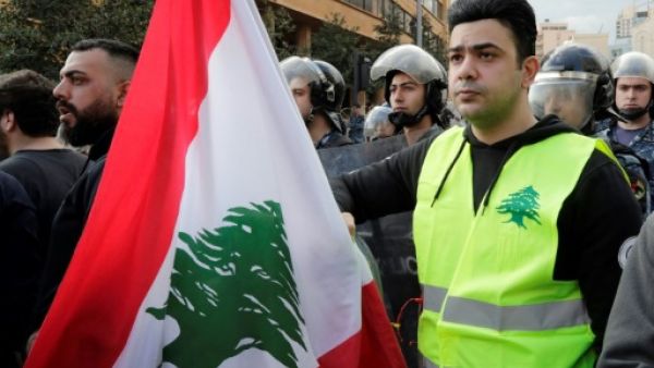 A Lebanese protester wears a yellow vest, inspired by France's Gilet Jaunes, during an anti-corruption demonstration in Beirut on December 23, 2018. (AFP/ File)