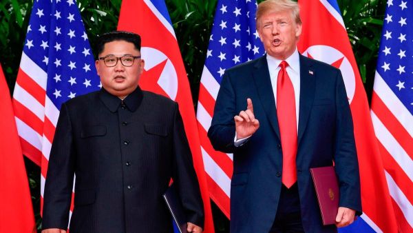 US President Donald Trump and North Korea leader Kim Jong-un in Singapore today. (Susan Walsh /AFP)