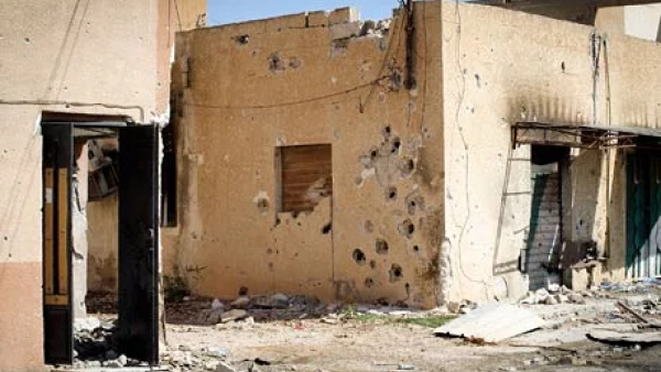 A building damaged by serious gunfire in Misrata, Libya. (AFP/File)
