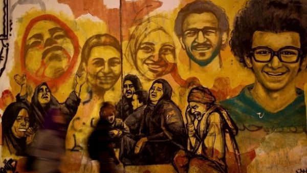 A mural depicting those killed during the November 2011 protests on Mohamed Mahmoud Street. (AFP)