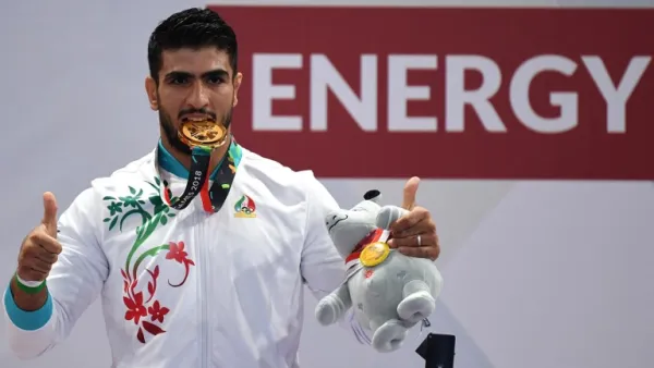 Iran's Mohsen Mohammadseifi poses with his gold medal at the men's sanda 70kg wushu medal ceremony of the 2018 Asian Games in Jakarta on August 23, 2018.
Juni Kriswanto / AFP