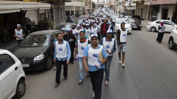 Supporters of Morocco's Party of Authenticity and Modernity take to the streets of Rabat to pass out campaign leaflets on October 5, 2016. (AFP/Fadal Senna)