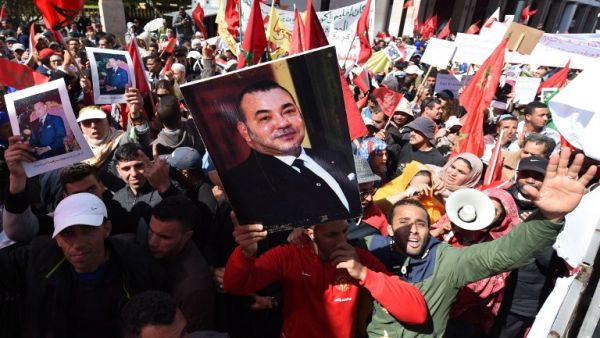Moroccan protesters in the capital city of Rabat hold posters of their king, in opposition to Ban Ki-Moon's statements on the Western Sahara. (AFP/Fadel Senna)