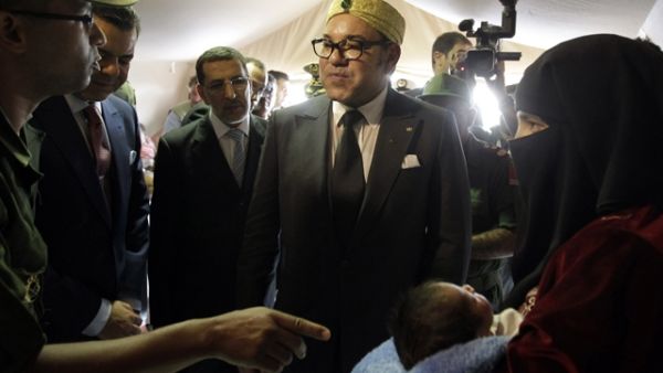 Moroccan King Mohammed VI (C) visits a field hospital treating Syrian refugees at the Zaatari camp in northern Jordan, which houses around 36,000 refugees. (AFP/File) Moroccan King Mohammed VI (C) visits a field hospital treating Syrian refugees at the Zaatari camp in northern Jordan, which houses around 36,000 refugees. (AFP/File)