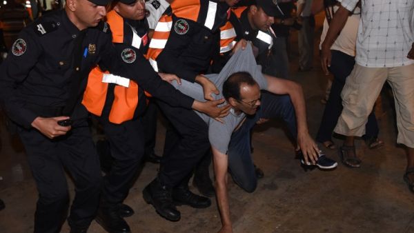Security forces seize a demonstrator in Rabat on June 20, 2017 during a protest in support of the grassroots movement for the neglected Rif region. The Rif has long had a tense relationship with the central authorities in Rabat, and it was at the heart of the Arab Spring-inspired protests in Morocco in February 2011.(Fadel Senna/AFP)