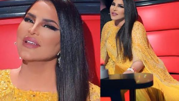 اختارت أحلام لإطلالتها فستان باللون الأصفر بتصميم "الكاب" Cape Dress