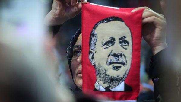 A supporter holds a scarf with image of Turkish President Recep Tayyip Erdogan during pre-election rally in Sarajevo, May 20, 2018.  Erdogan holds today the only election rally outside Turkey ahead of June 24 presidential and parliamentary elections. Sarajevo was chosen after several EU countries, including Germany, banned such rallies. (Oliver Bunic, AFP/File Photo) 
 A supporter holds a scarf with image of Turkish President Recep Tayyip Erdogan during pre-election rally in Sarajevo, May 20, 2018.  Erdogan holds today the only election rally outside Turkey ahead of June 24 presidential and parliamentary elections. Sarajevo was chosen after several EU countries, including Germany, banned such rallies. (Oliver Bunic, AFP/File Photo)